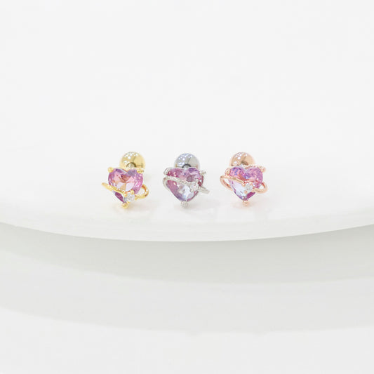 Heart-shaped earrings with purple gemstones on a white background