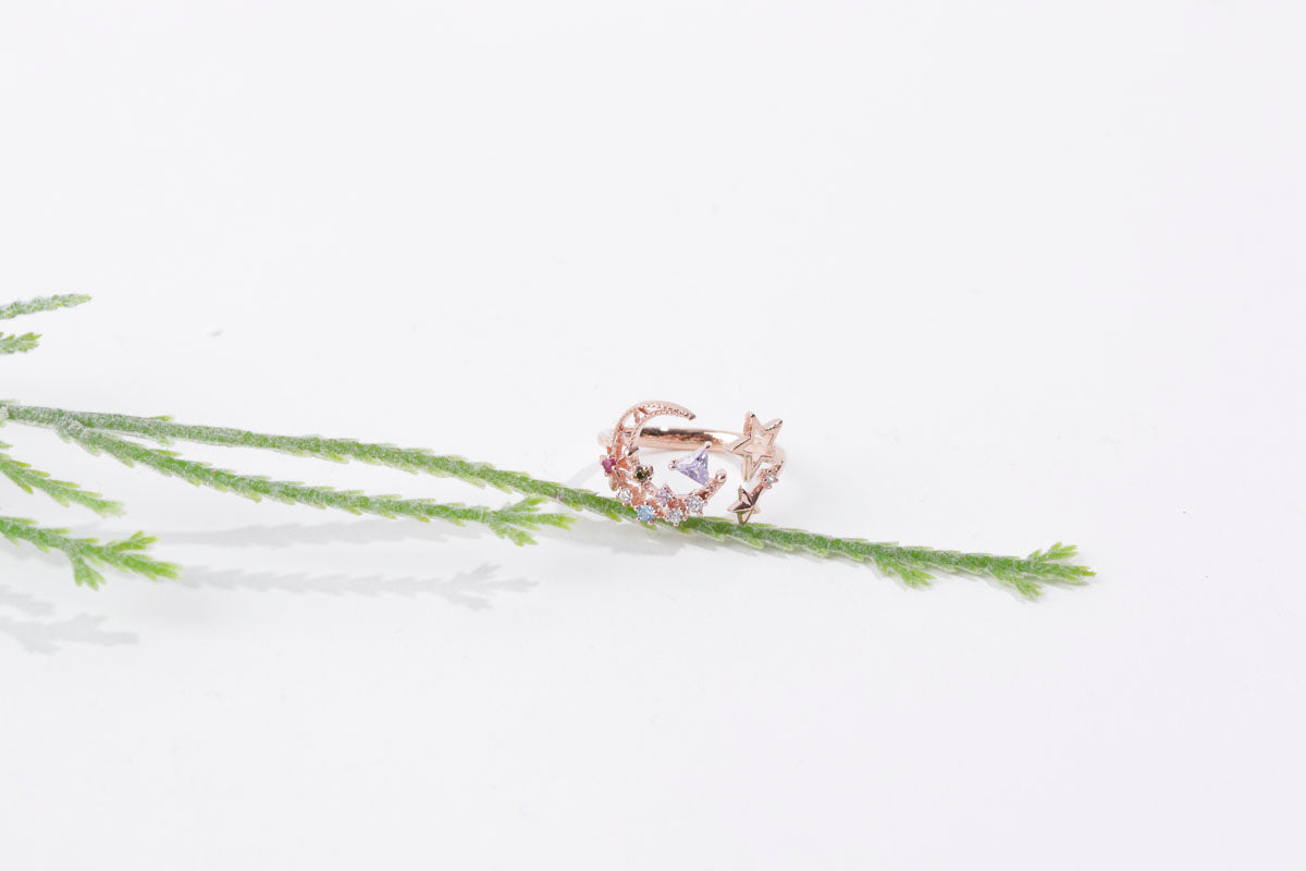 Rose gold ring with heart design on a white background